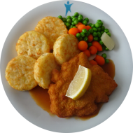 Gebratenes Putenschnitzel mit Zitronenecke (81), Geflügelsoße (81) und Möhrengemüse dazu Röstitaler