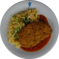 Schweineschnitzel 'Toscana' in würziger Kräuterpanade (15,51,81) dazu Pastasotto mit gehobeltem Hartkäse (3,15,19,24,81) dazu frisches Obst