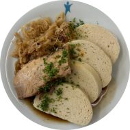 Krustenbraten vom Schwein in Schwarzbiersoße (22,48,81) dazu Bayrich Kraut (19) und hausgemachte 'Böhmische Knödel' (15,19,81)