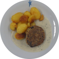 Hausgemachtes Kidneybohnenmedaillon (2,18,22,49,81,84) an Kräutersoße (18,81) dazu würzige Schwenkkartoffeln