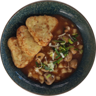 Kartoffel-Pilzgulasch mit frischen Champignons und Lauchzwiebeln dazu Kartoffelröstiecken