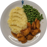 Chicken Nuggets (3,81) an Geflügelsoße (81) dazu Erbsengemüse und hausgemachter Kartoffelstampf (19)