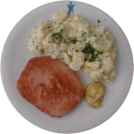 Ofen Fleischkäse (2,3,8,21,22) dazu hausgemachter Kartoffelsalat mit Gurke, Paprika und Apfel (9,15,19,81)