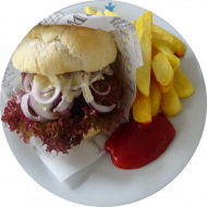 Vegan Fox Burger mit Avocado-Quinoa-Patty, Tomaten, Salat, Zwiebeln und Gurke (9,22,81,84) dazu Rustico Pommes