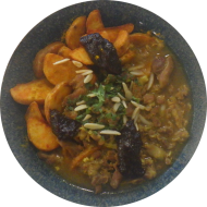 Puten-Tajine mit Backpflaumen-Topping (2,19,49,71) dazu Currywedges
